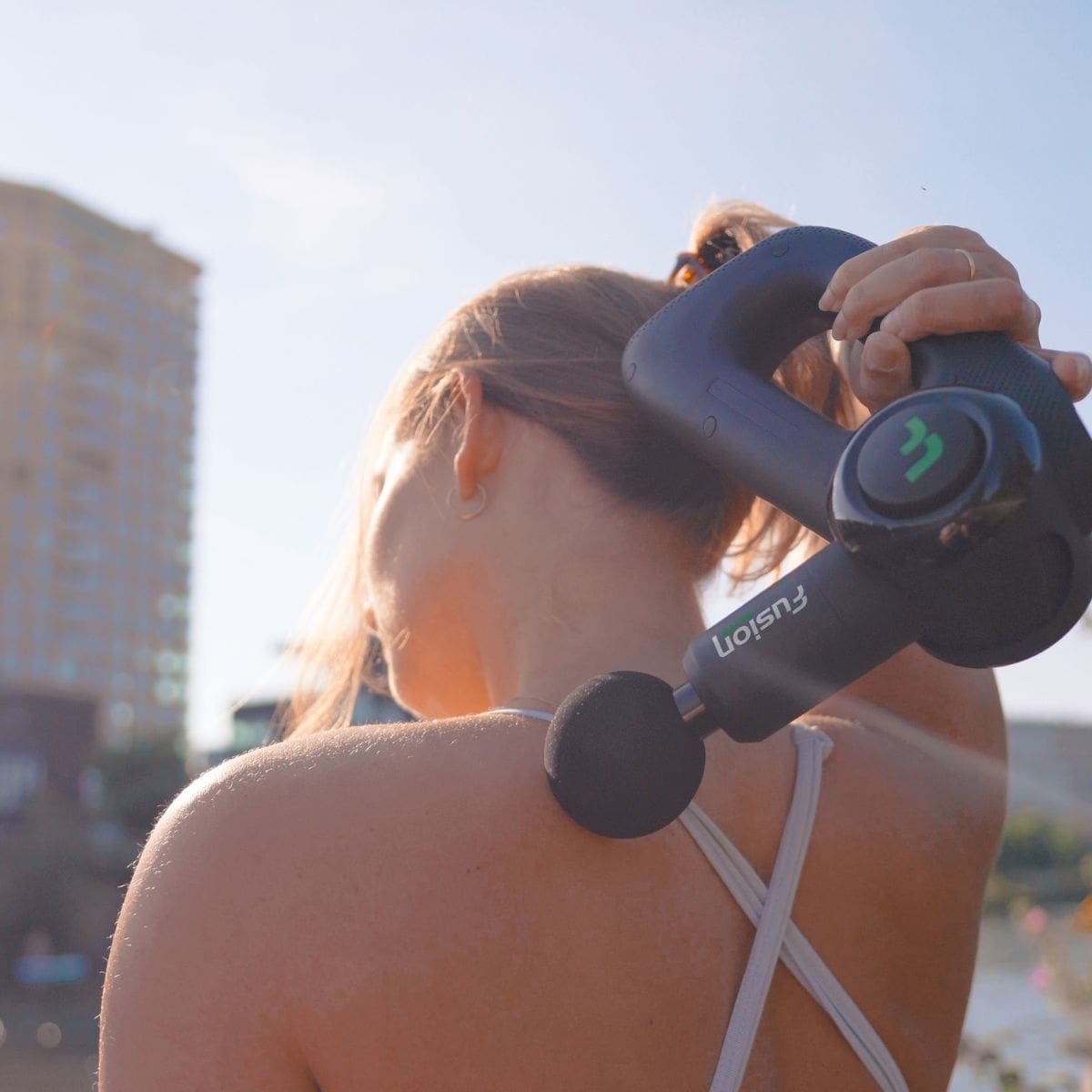 how to use a massage gun on your back